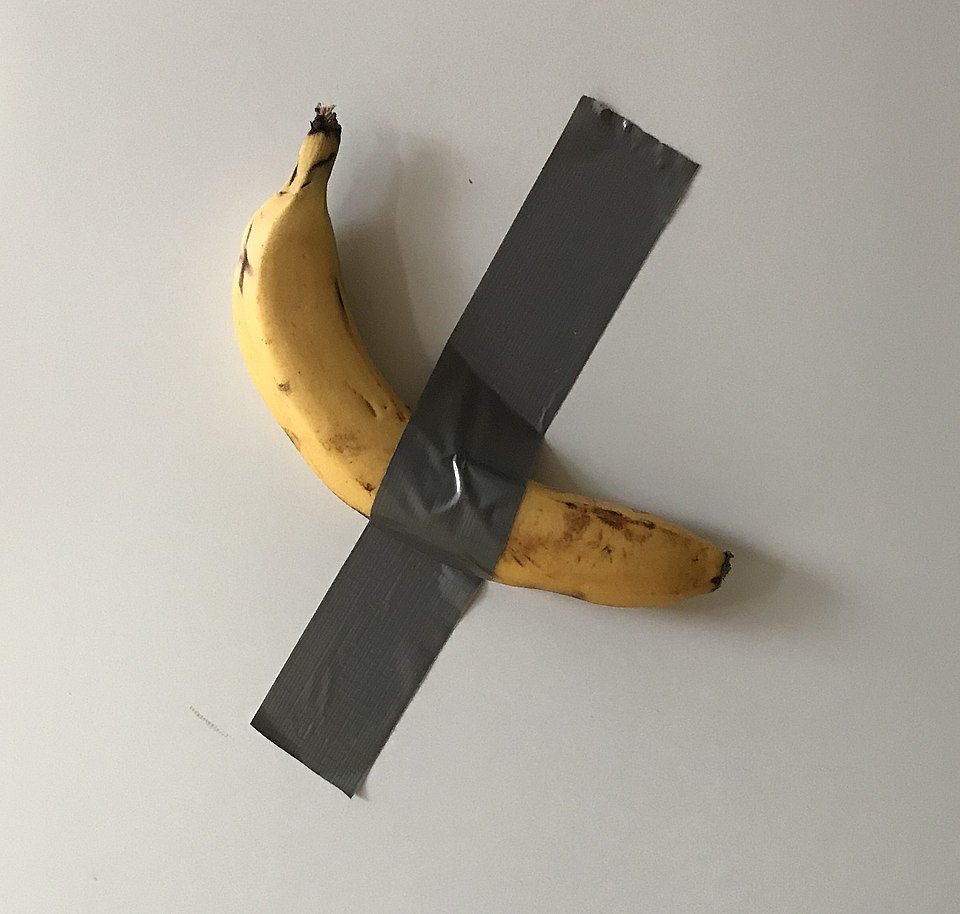 A banana duct-taped to a wall