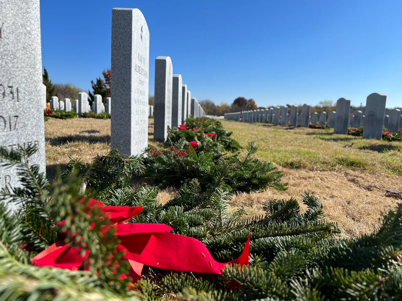 closeup of wreaths on the graves at DFW National Cemetery